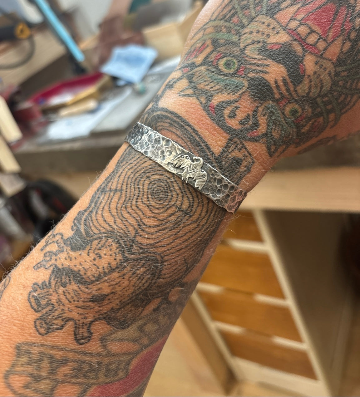 Reserved- Hammered thunderbird cuff.