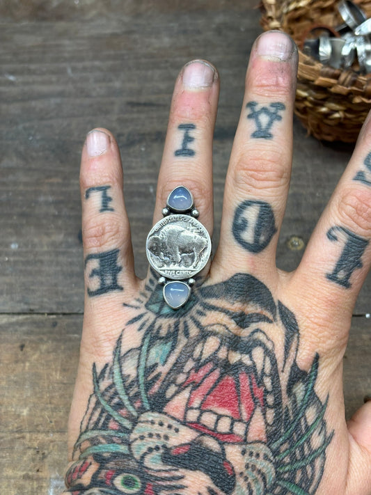 buffalo nickel and opalite ring on tiger tattooed hand with silver shots