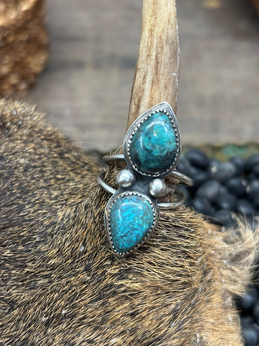 double teardrop turquoise ring with 2 shots and 2 wire bands. set on a deer antler for show. silver and stoned small business PNW