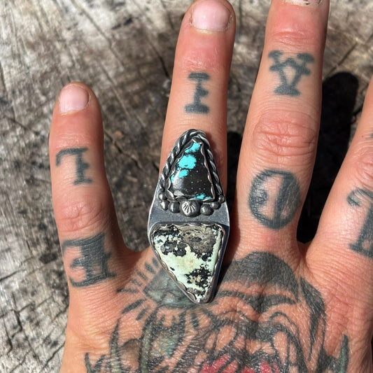 top view of turquoise and variscite ring. triangular stones with scalloped edge bezel and twist wire details with silver shots, hand stamped, worn on left ring finger.