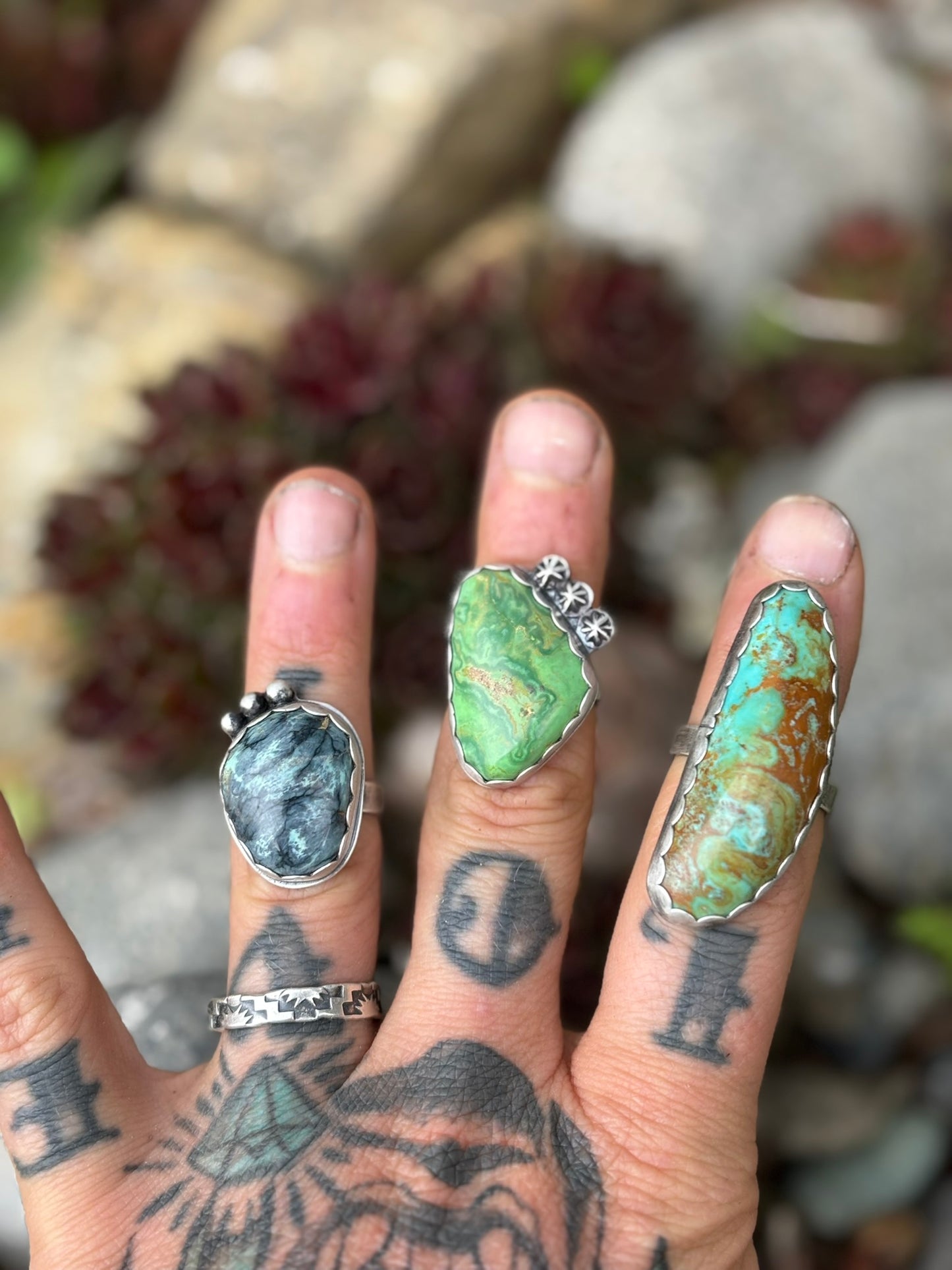 three matching rings from a collection all with scalloped edge bezel stamped with artists signature and all handmade