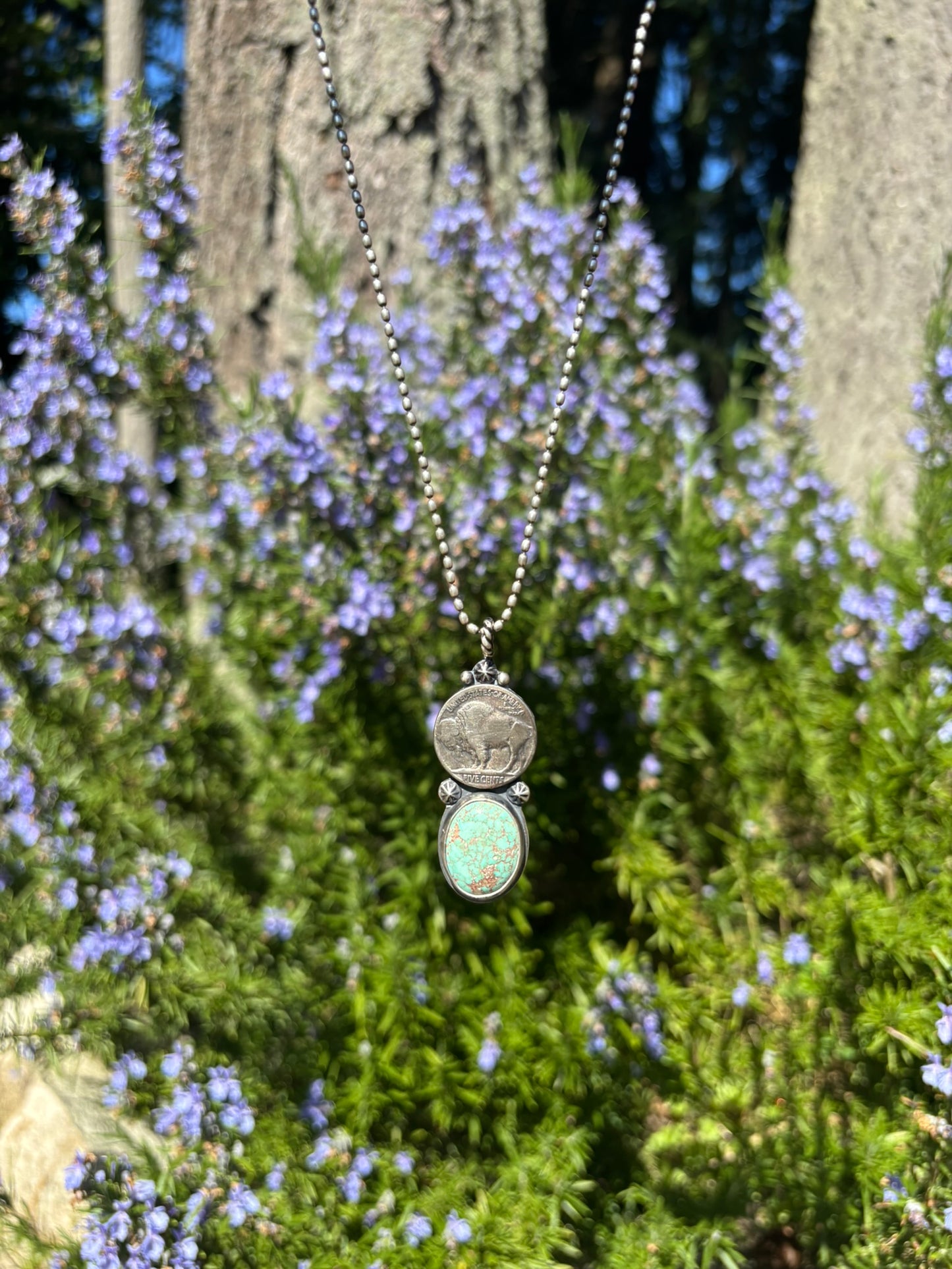 handmade buffalo nickel and turquoise pendant on silver ball chain with rosemary backdrop