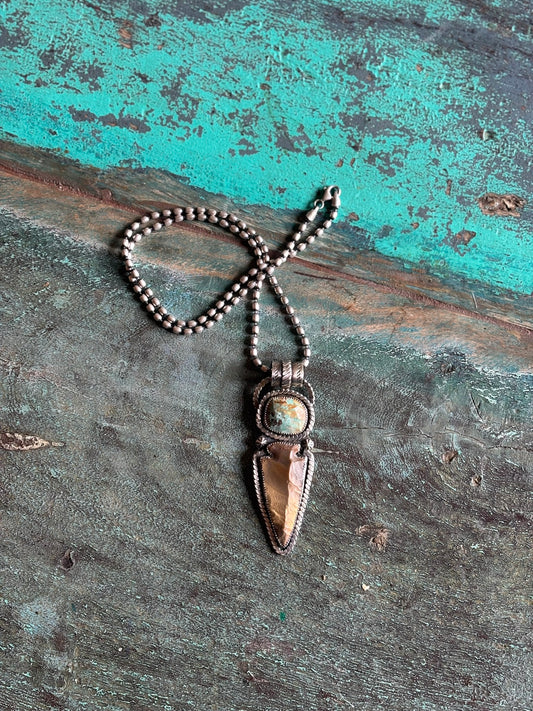faceted turqoise stone and real stone arrowhead set in sterling silver with twist wire details and large hand stamped bail