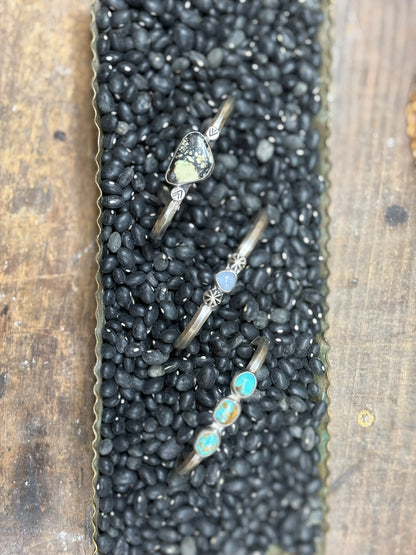 3 handmade cuff bracelets featuring opalite, turquoise and variscite stones on hammered triangle wire band. artist signed on inner band and marked 925 sterling