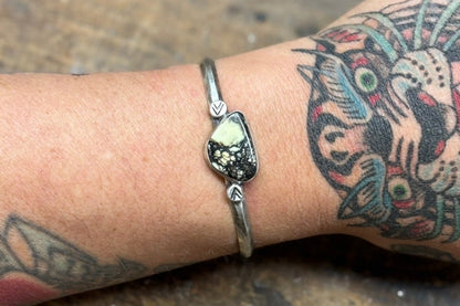 variscite cuff bracelet with hand stamped silver embellishments on hammered triangle wire band. 